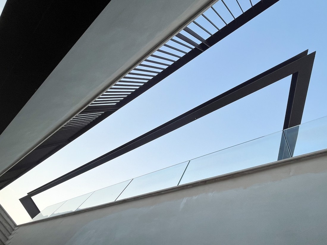 Steel blade of the canopy against the sky